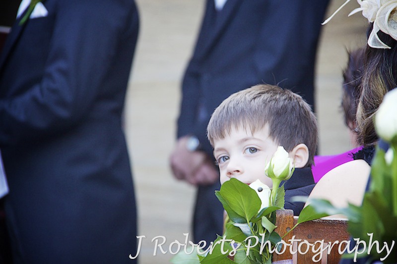 Paige boy cheeky look over shoulder at wedding - wedding photography sydney